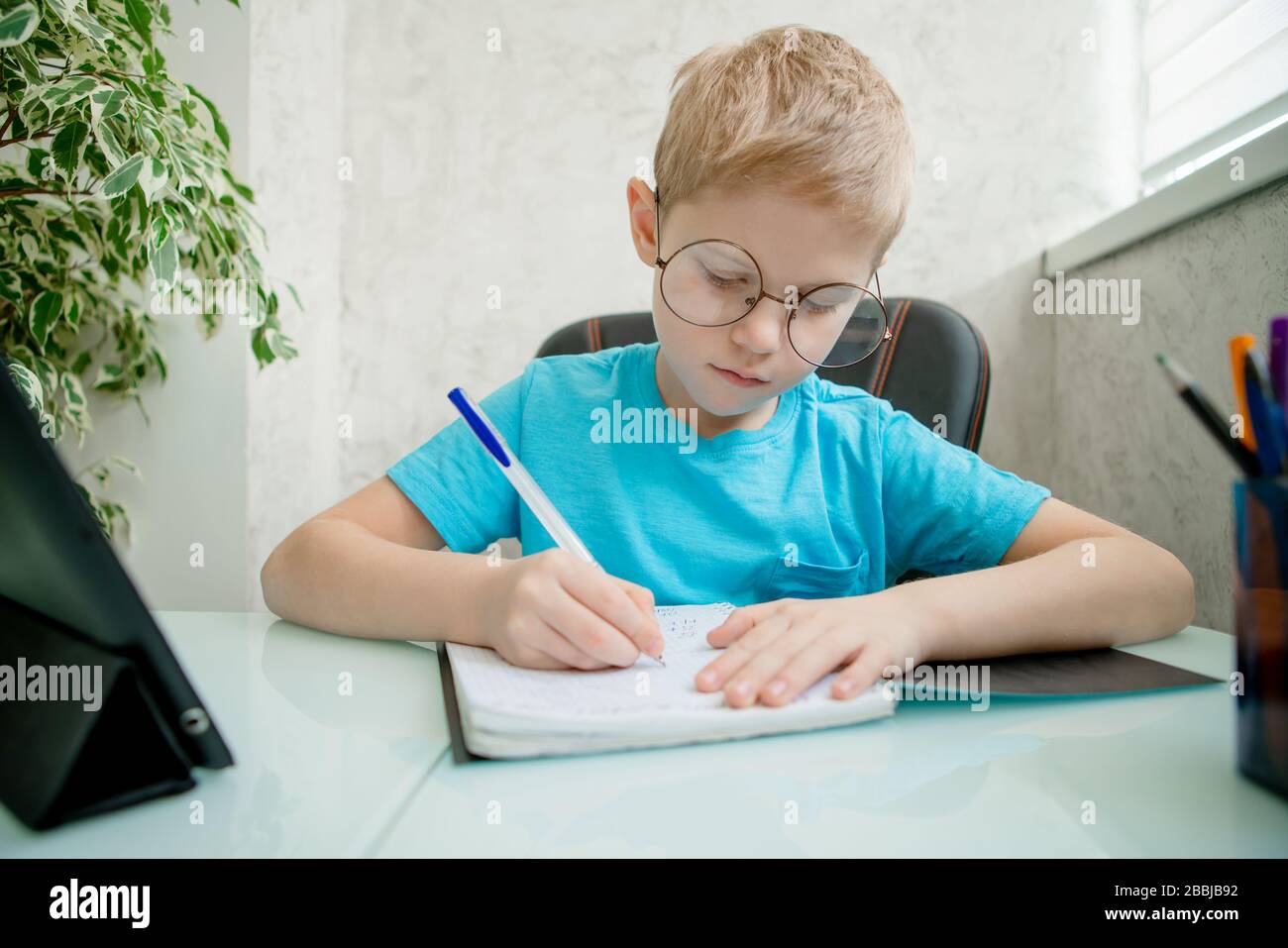 Young boy learn by tablet at home. Distance learning in quarantine ...