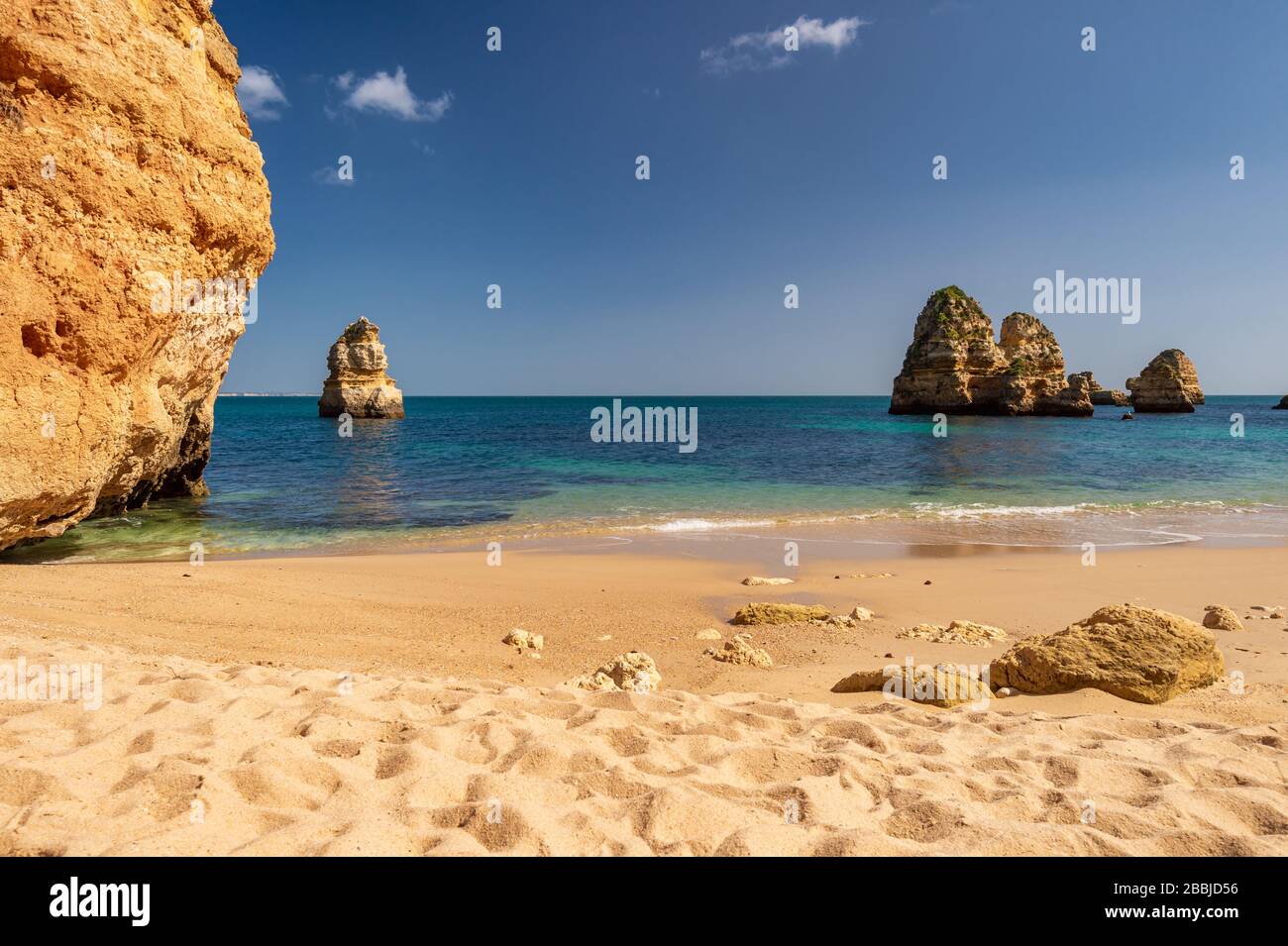 Atlantic ocean and cliffs at Praia do Camilo Beach, Lagos, Portugal Stock Photo