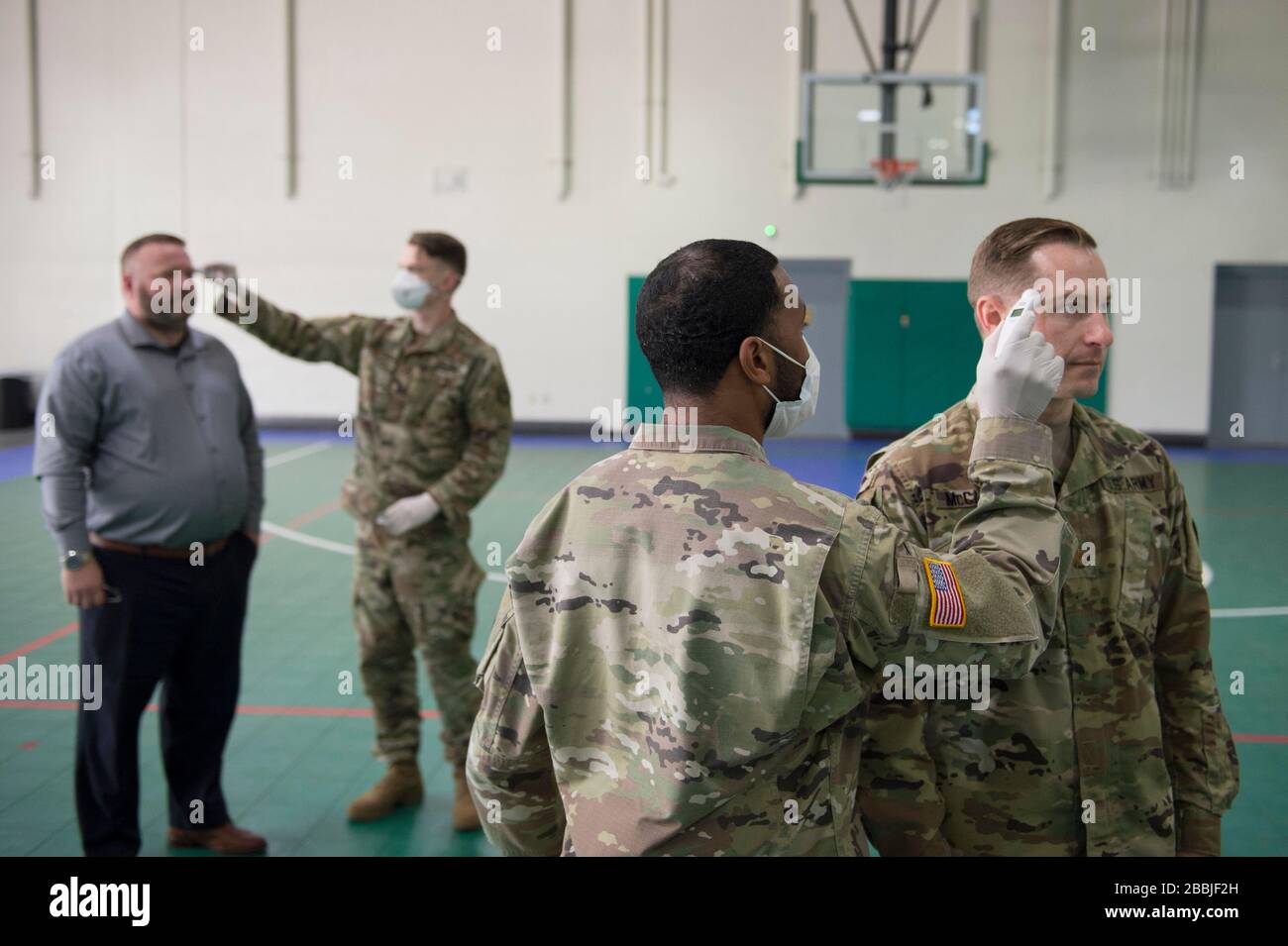 Austin, United States Of America. 31st Mar, 2020. Austin, United States of America. 31 March, 2020. Texas National Guard Soldiers test the temperature of all persons entering facilities on Camp Mabry to prevent the spread of COVID-19, coronavirus March 31, 2020 in Austin, Texas. Credit: Andrew Ryan Smith/U.S. Navy Photo/Alamy Live News Stock Photo