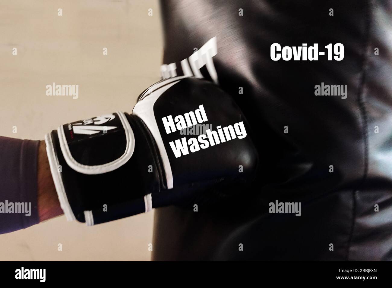 Black boxing glove representing hand washing, punching a boxing bag