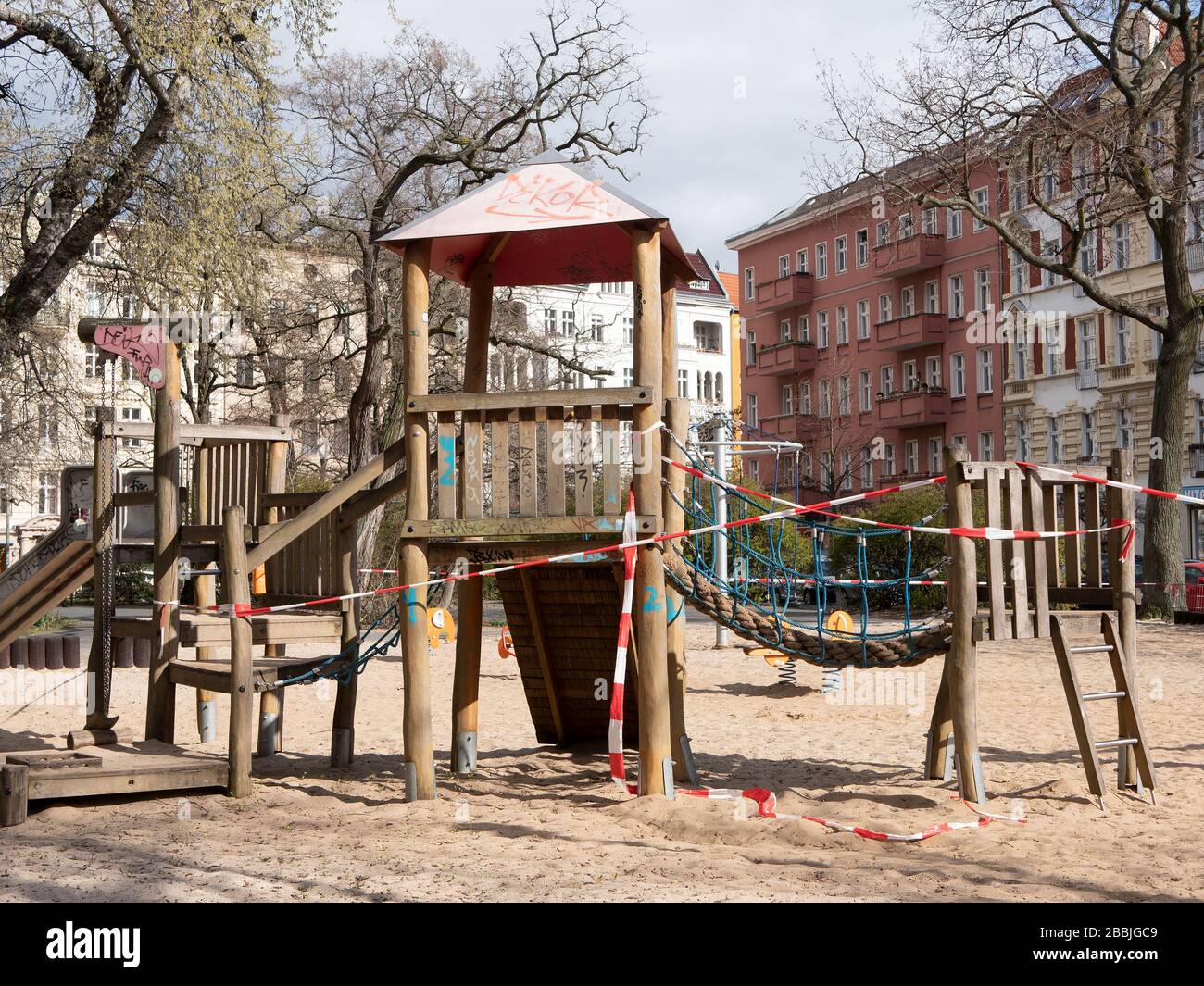 BERLIN, GERMANY - MARCH 31, 2020: Closed Playground With Barrier Tape Due To Corona Pandemic In Berlin, Germany Stock Photo