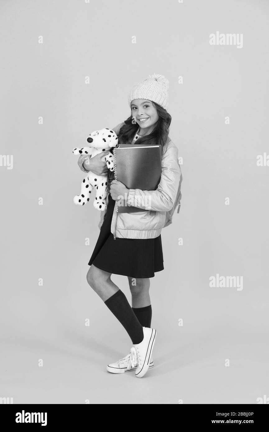 Having fun while learning. Small girl go to preschool with toy. Happy