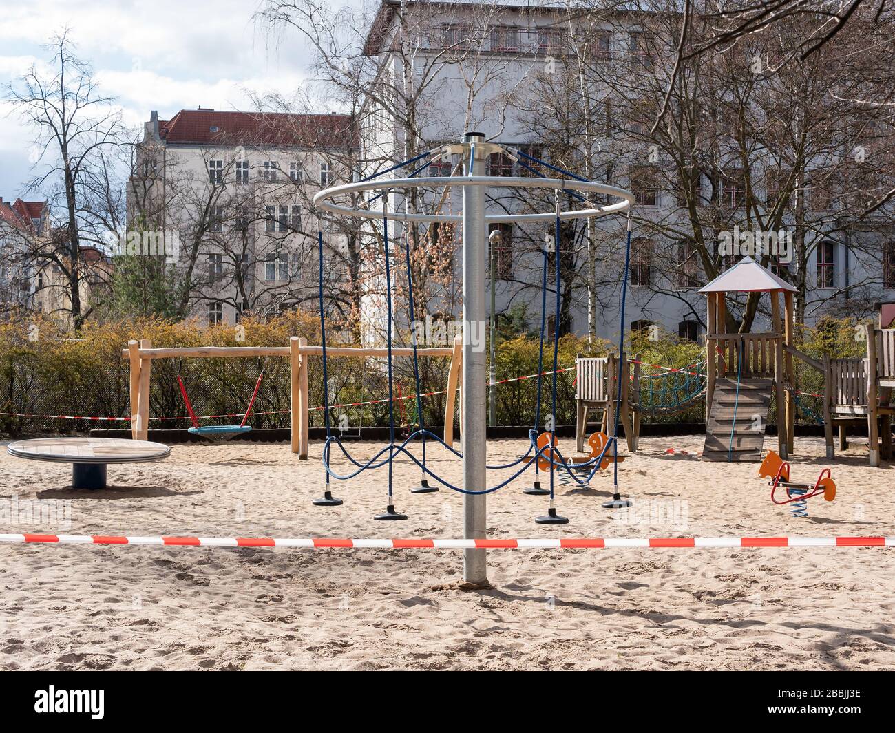 Closed Playground With Barrier Tape Due To Corona Pandemic In Berlin, Germany In March 2020 Stock Photo