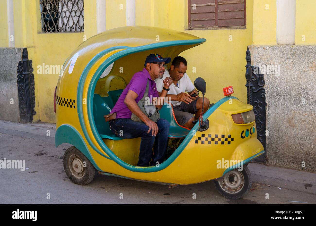 Coco taxi on a break, Havana, Cuba Stock Photo