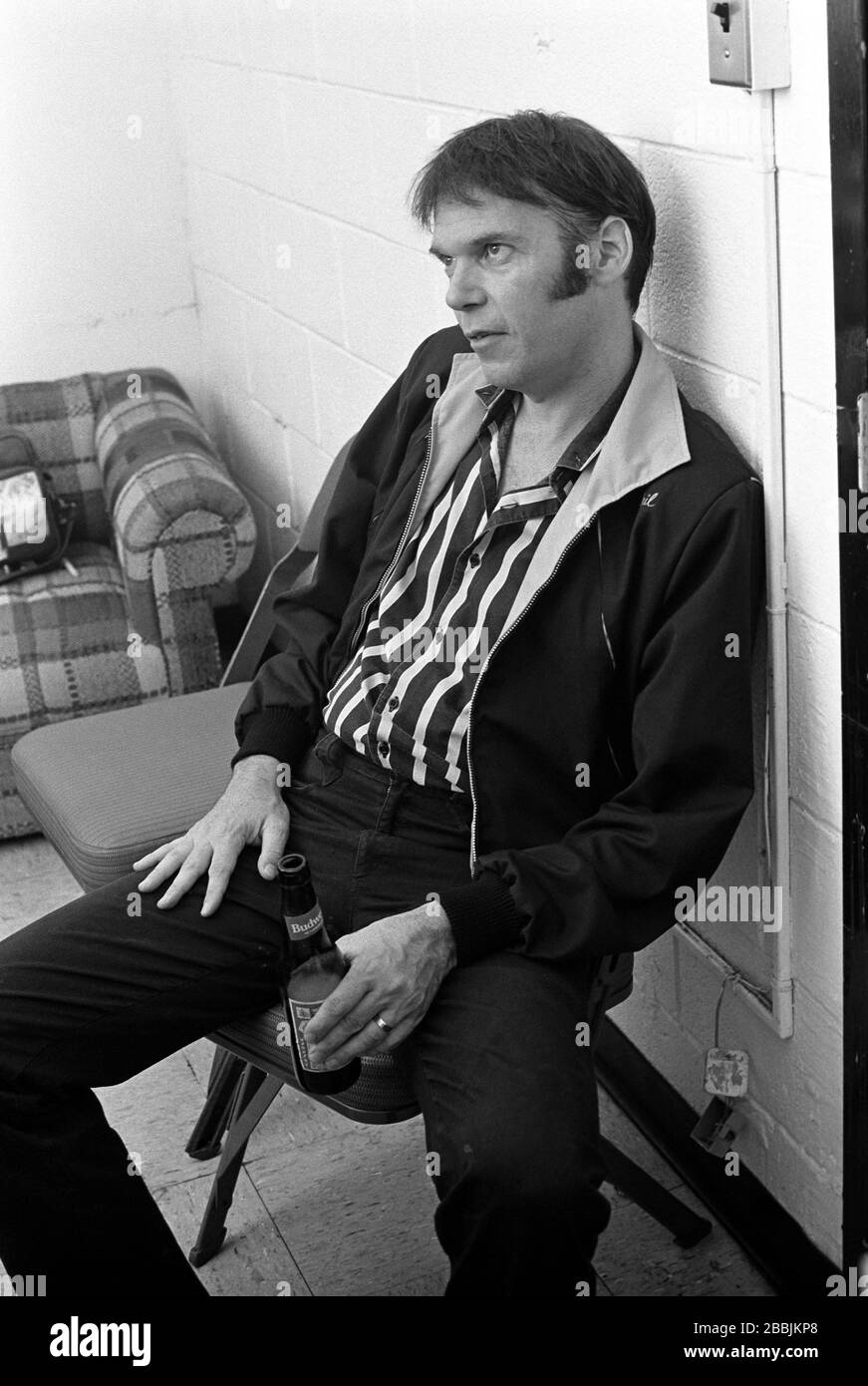 Neil Young backstage after his gig at the Spectrum in Philadelphia, PA. August 28, 1983.Credit:  Scott Weiner / MediaPunch Stock Photo