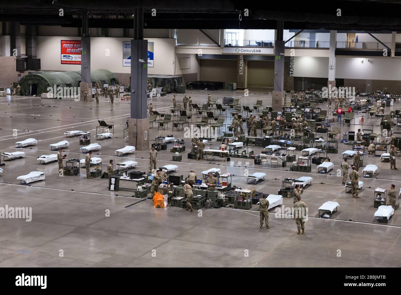 Overview of the field hospital in CenturyLink Field Event Center in Seattle, Washington on March 31, 2020. Soldiers from the 627th Army Hospital at Fort Carson, Colorado are deploying a field hospital for non-COVID-19 cases that will house 150 beds when completed. Stock Photo