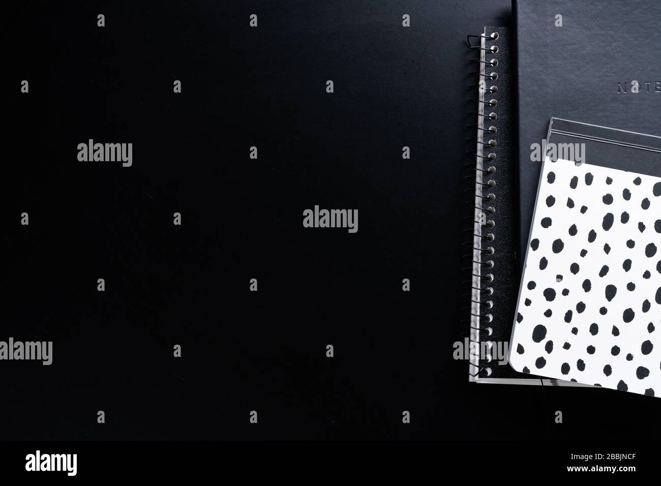 Black style set: notepad, pen and paper clips on Black background Stock Photo