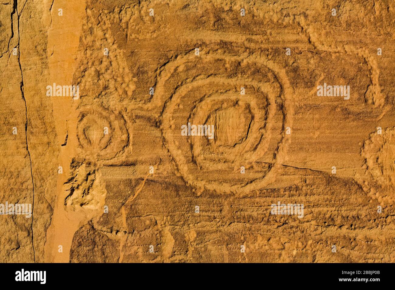 Spiral Petroglyph carved by ancestral Pueblo peoples, along the Petroglyph Trail in Chaco Culture National Historical Park, New Mexico, USA Stock Photo