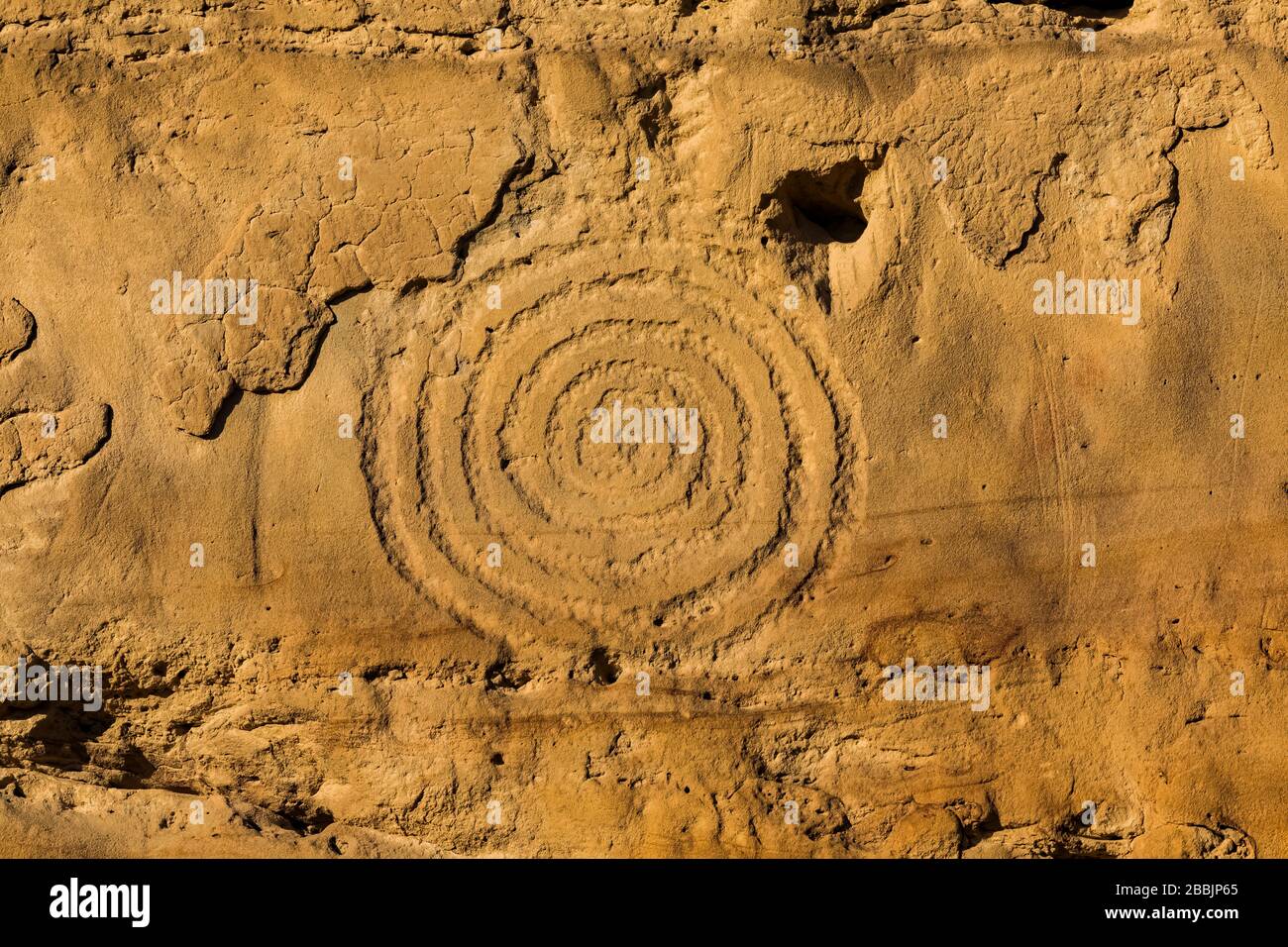 Spiral Petroglyph carved by ancestral Pueblo peoples, along the Petroglyph Trail in Chaco Culture National Historical Park, New Mexico, USA Stock Photo