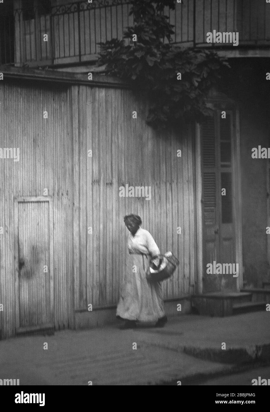 Woman going to market, New Orleans, Louisiana, USA, Arnold Genthe, 1920's Stock Photo