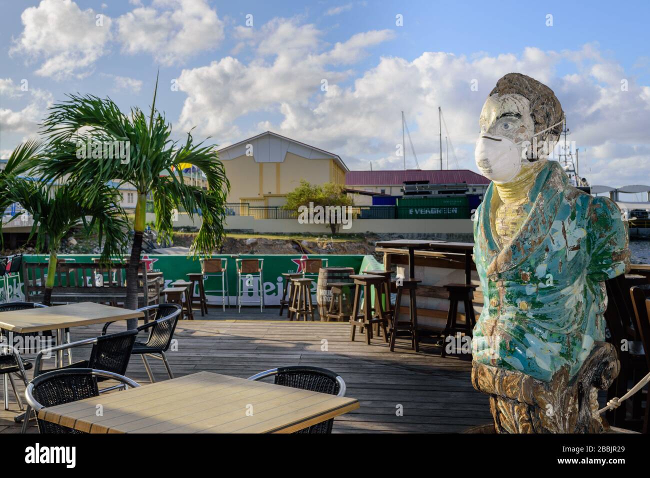 Bar mascot at Sint Maarten Yacht Club Bar & Restaurant wears a (used) mask while it is closed for the Covid-19 Pandemic in late March, April & May Stock Photo