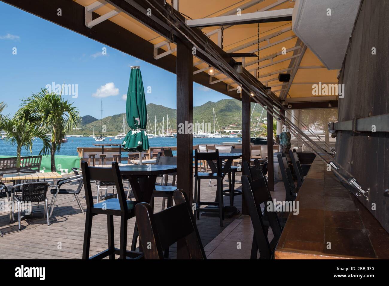 Impact of Covid-19 in the Caribbean: normally busy, shutters are down at SMYC Bar & Restaurant while closed in late March, April & May 2020 Stock Photo
