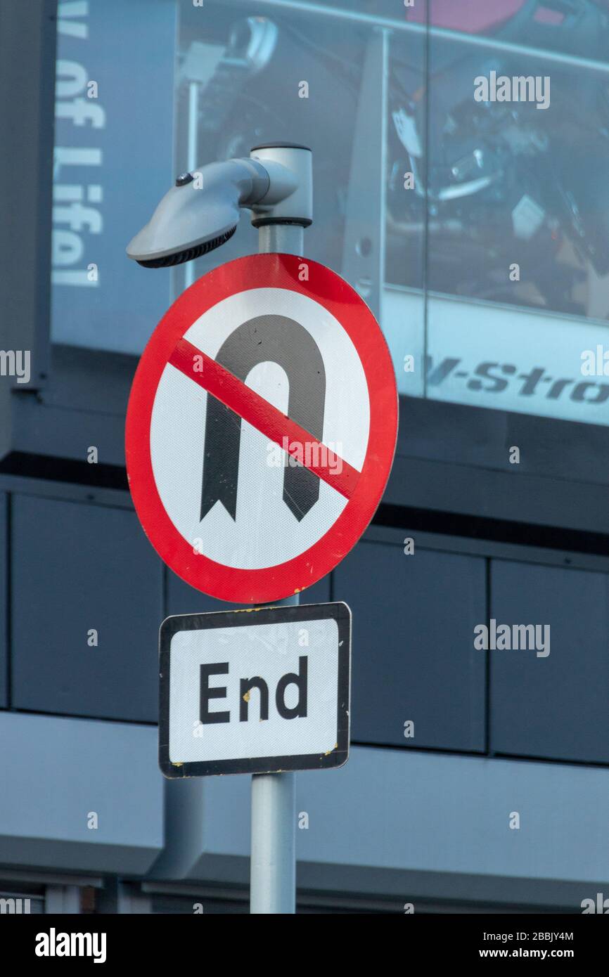 Bristol-March 2020-England- a close up view of a street light with a no uturns sign at the bottom Stock Photo