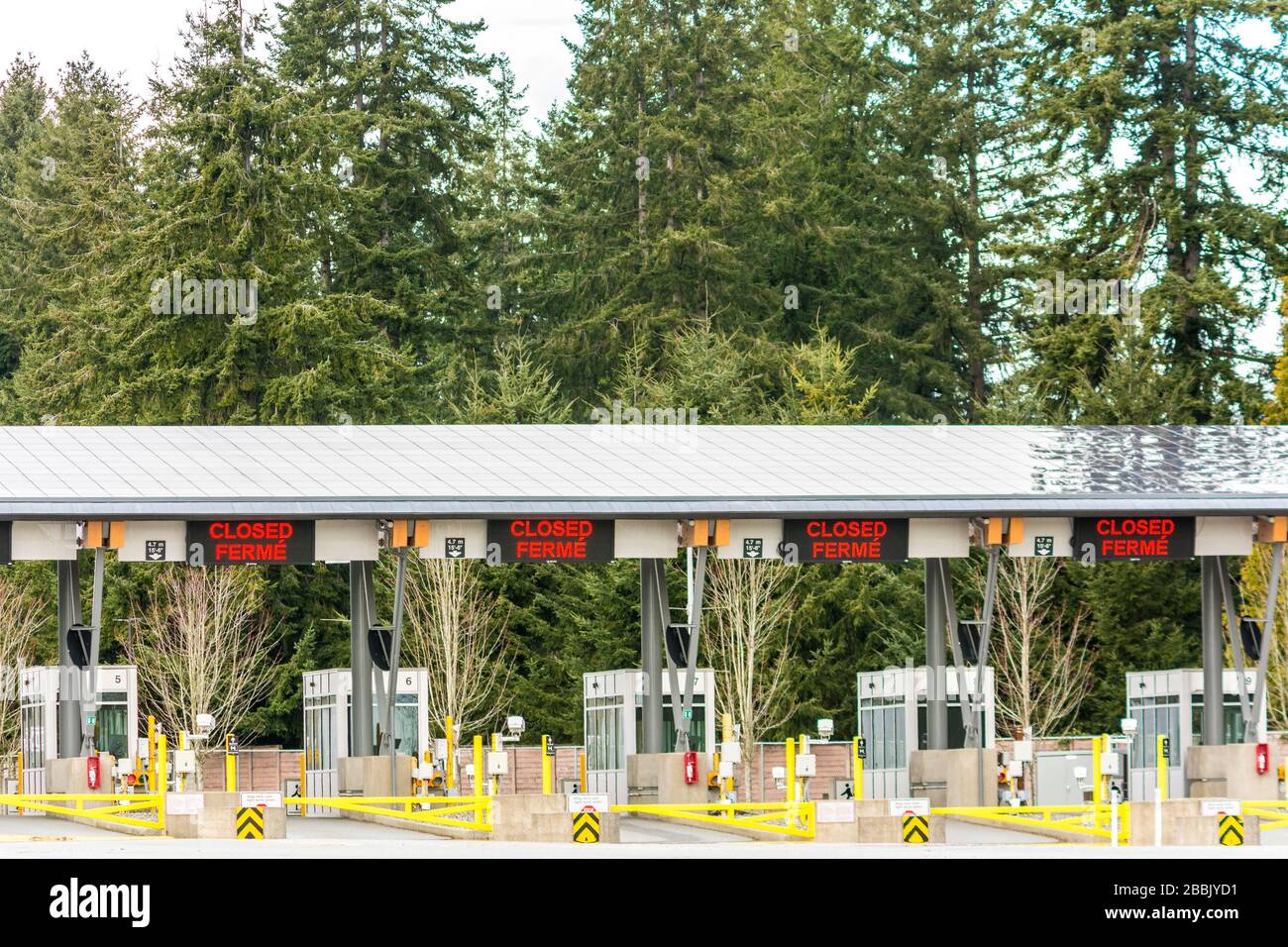 Surrey, Canada - March 29, 2020: Empty inspection stations at closed Peace Arch Canadian border entrance during Coronavirus Covid-19 outbreak Stock Photo