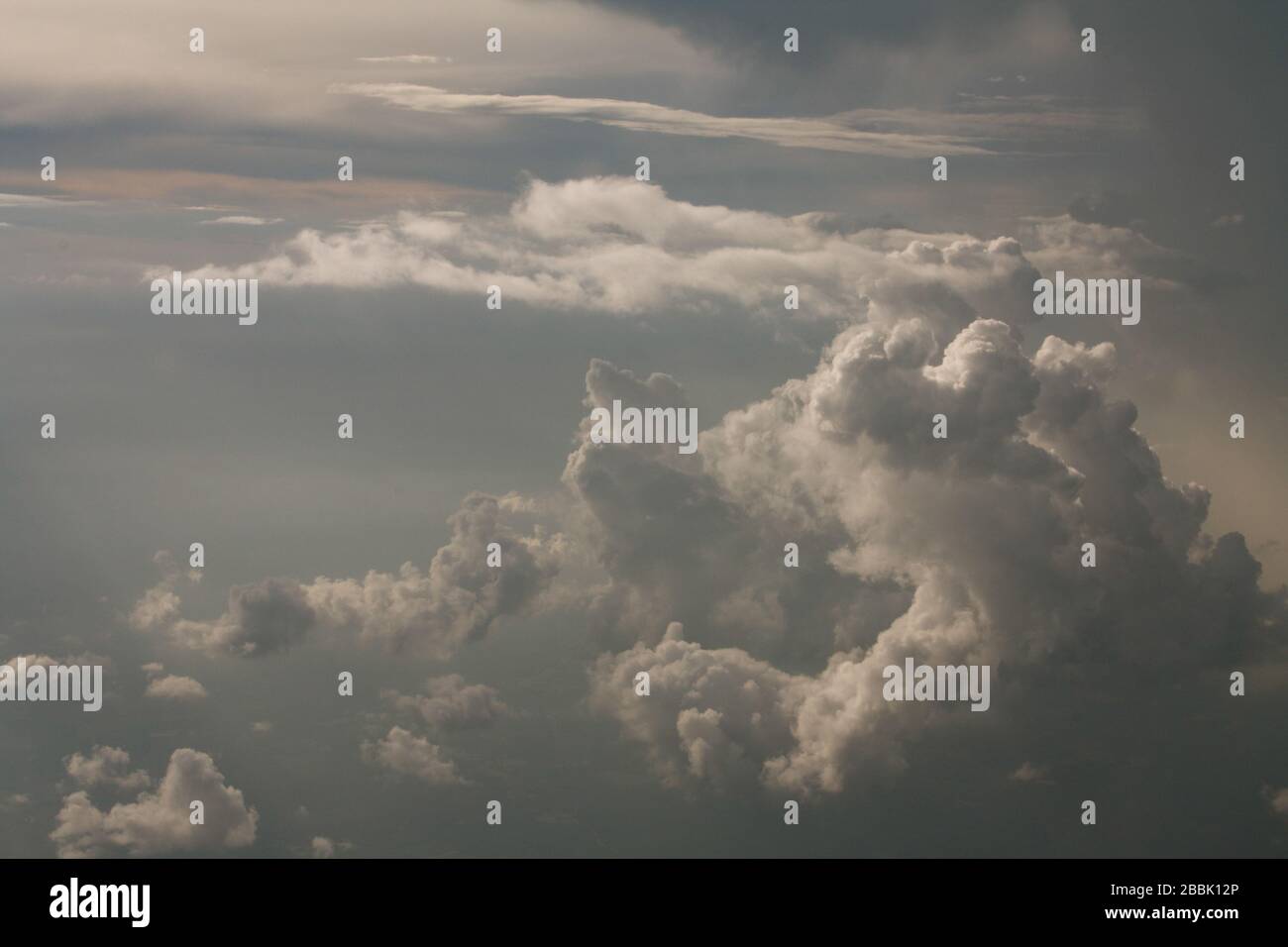 Fluffy white clouds in a gray sky Stock Photo - Alamy