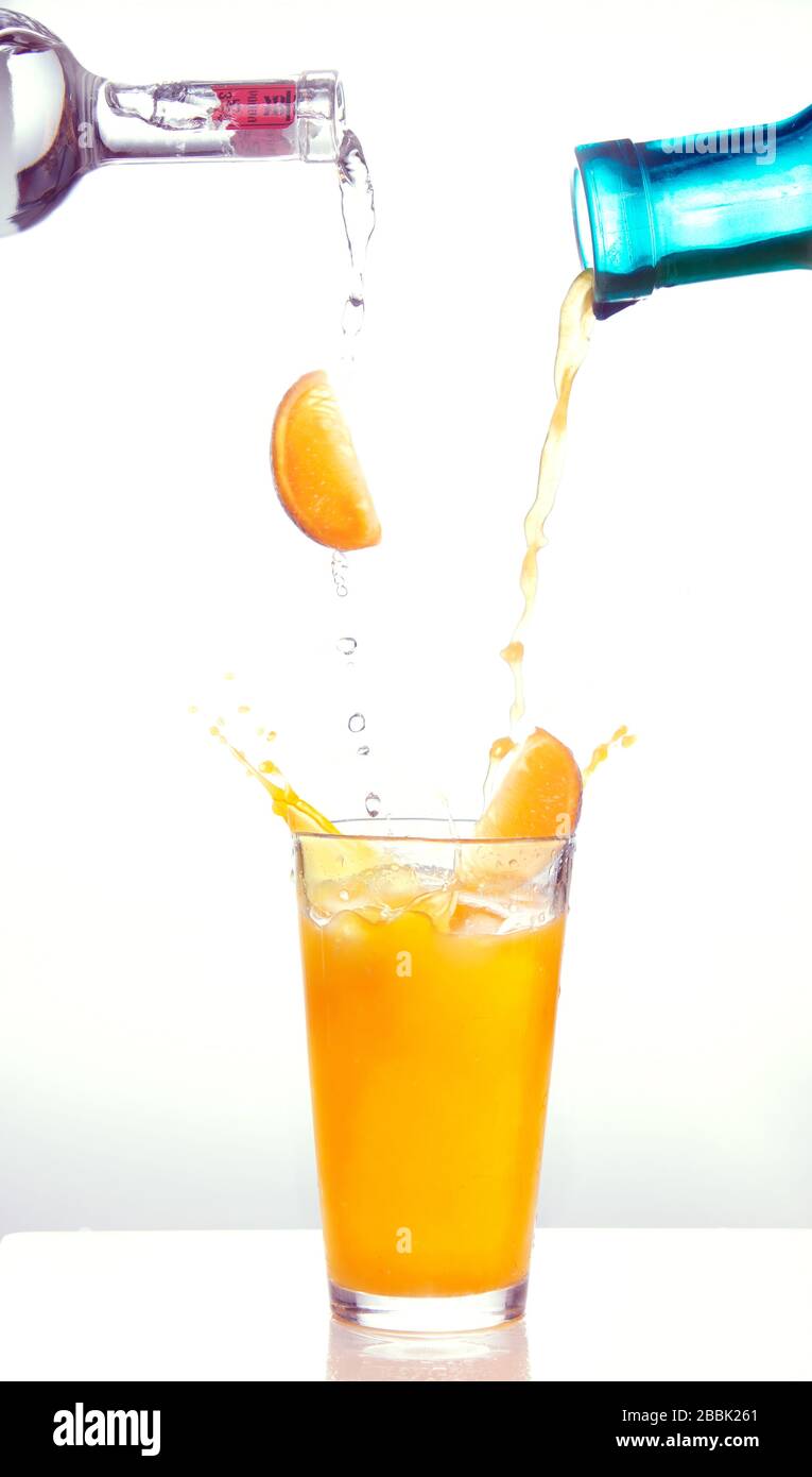 Pouring a drink doing a splash Stock Photo