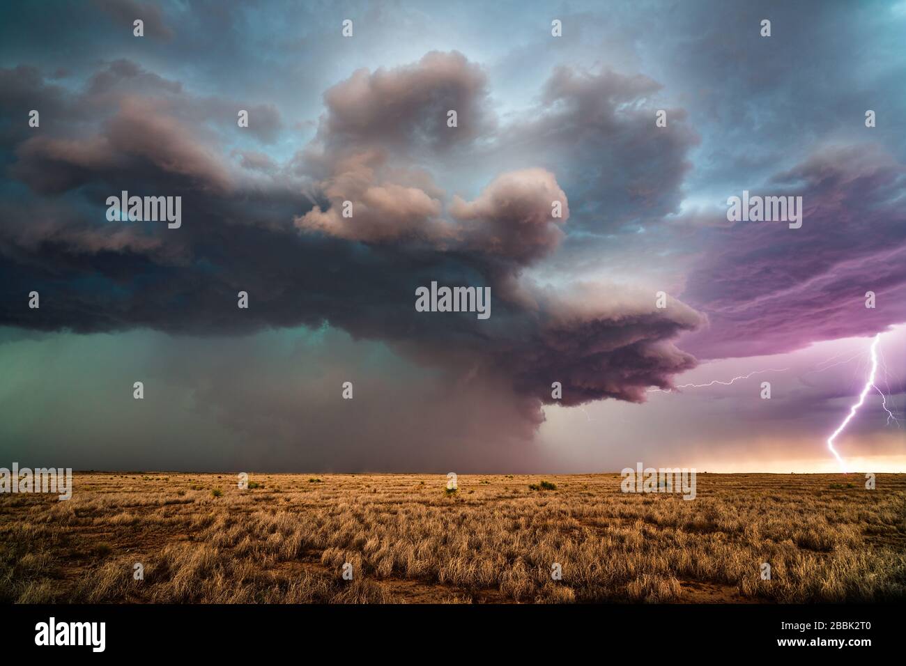 Lightning bolt strikes in a supercell thunderstorm with dramatic clouds ...
