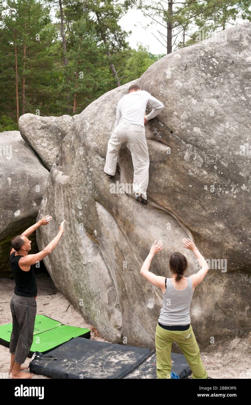 Bouldering at the rocks in the forests of Fontainebleau Stock Photo