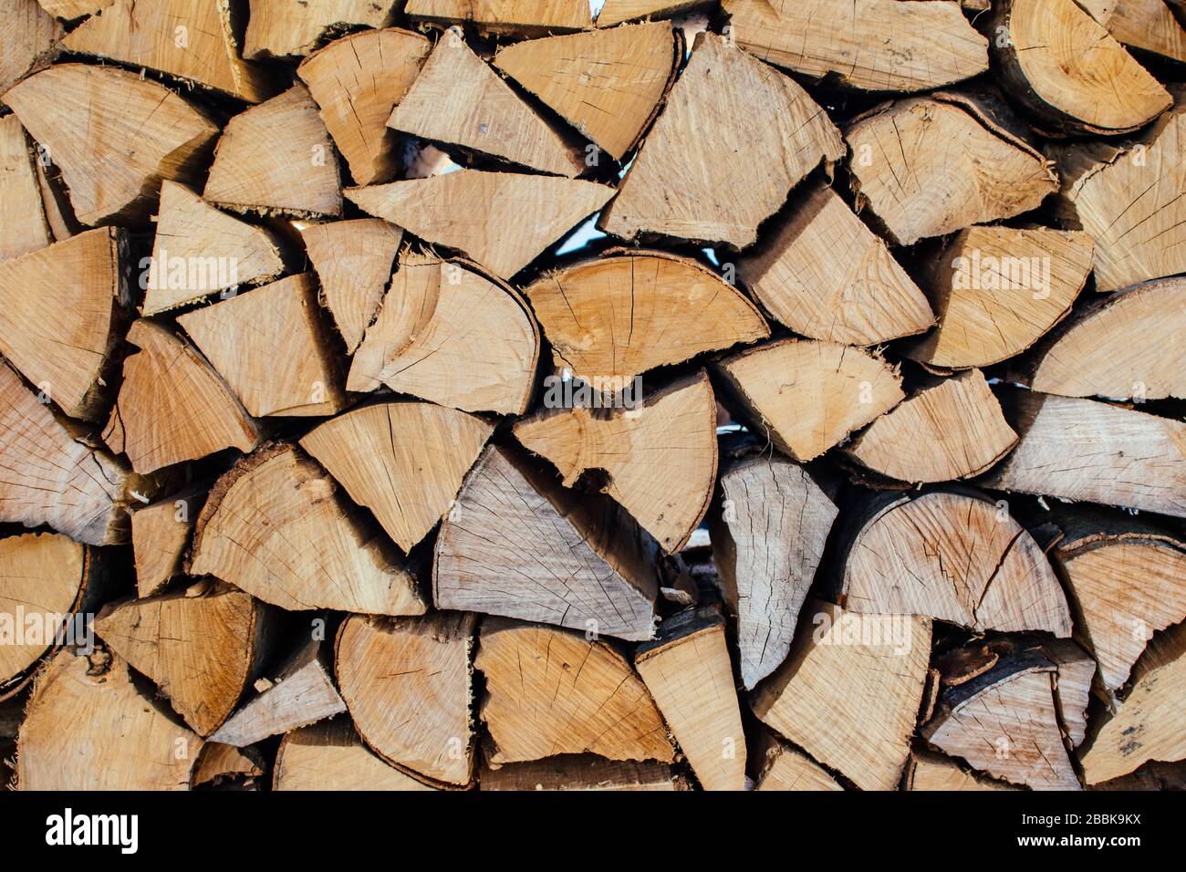 Surface of chopped fire wood, folded exactly crushed firewood. Close up. Wood background. Stock Photo