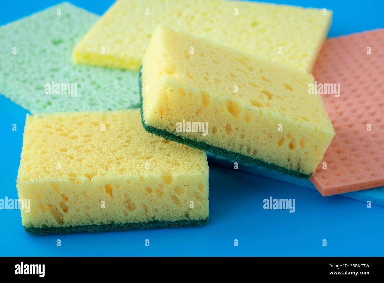 Colorful kitchen dry sponges for cleaning, housekeeping. Kitchen dishcloth close-up, clean up concept, housework Stock Photo