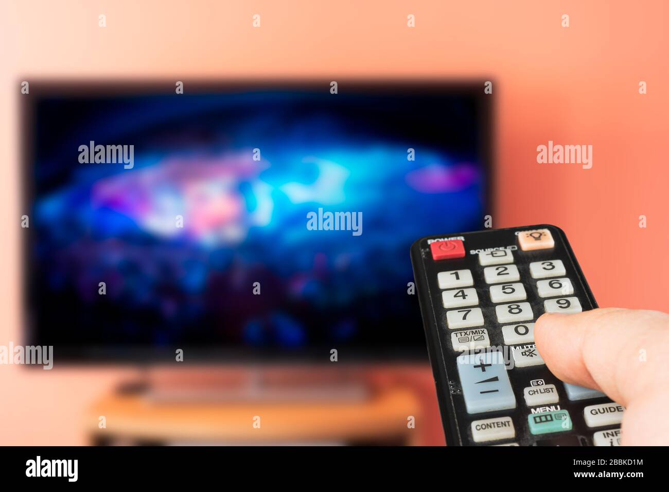 Caucasian man watching esports or concert on TV at home. Changing