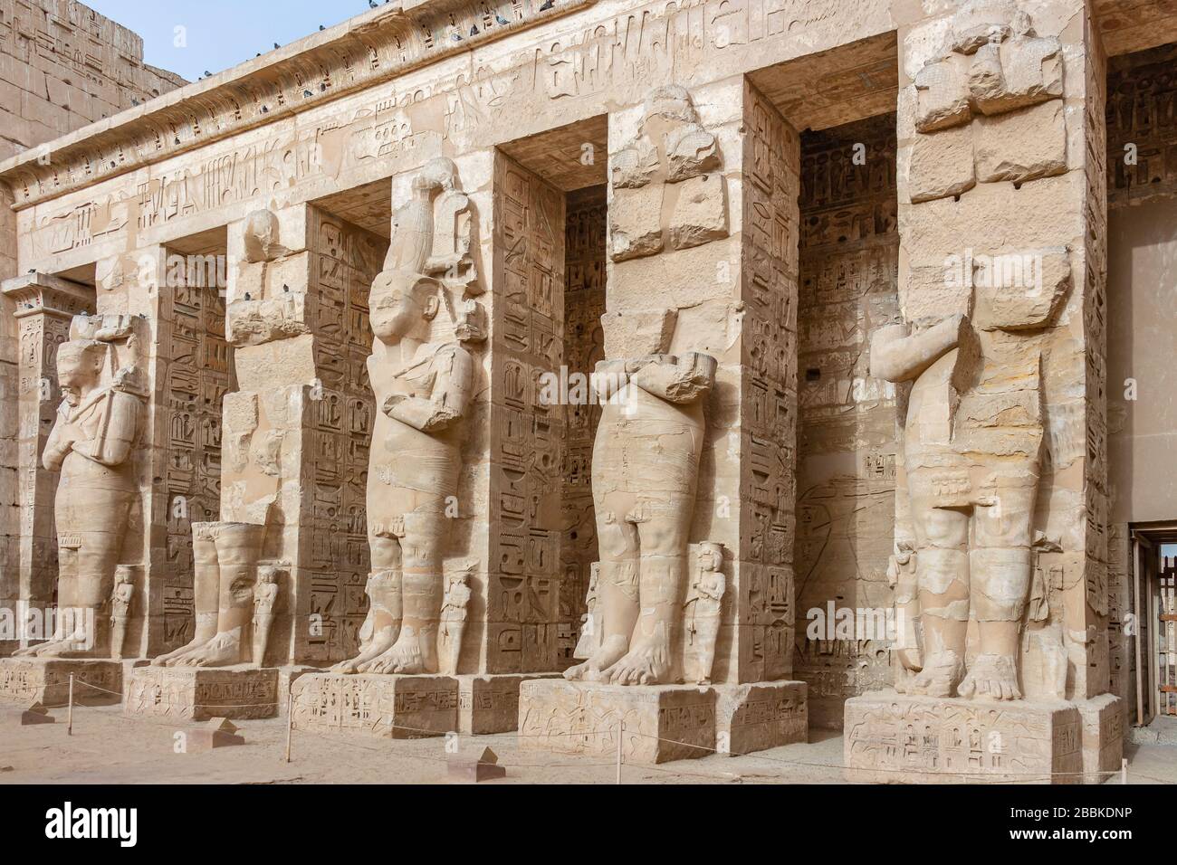 Ramessid statues and columns in the first courtyard of the Mortuary ...