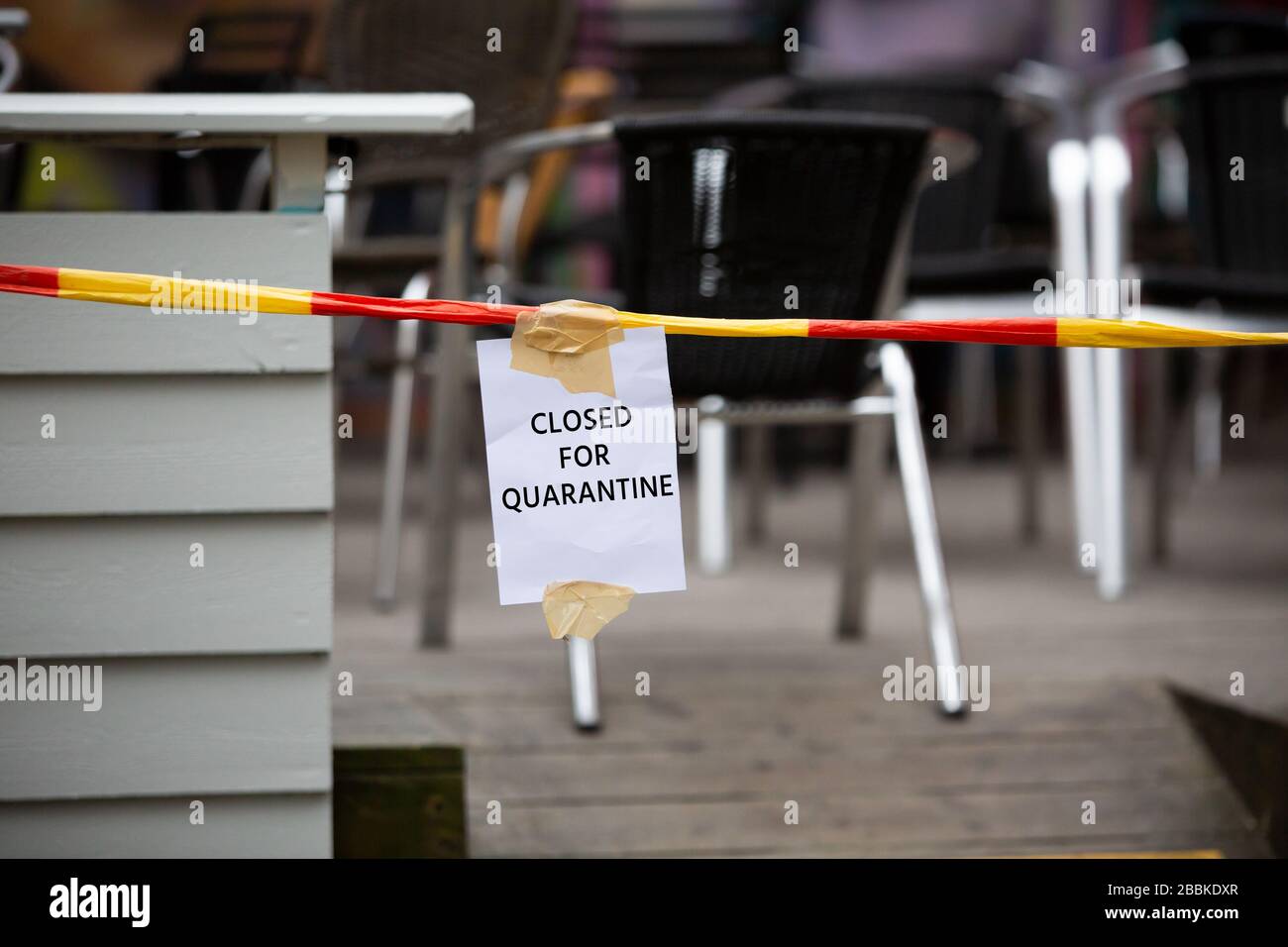 Empty cafe with a sign ' Closed for quarantine' Stock Photo