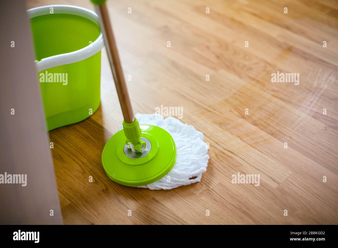 Cleaning gear mopping parquet floor. Closeup Stock Photo Alamy