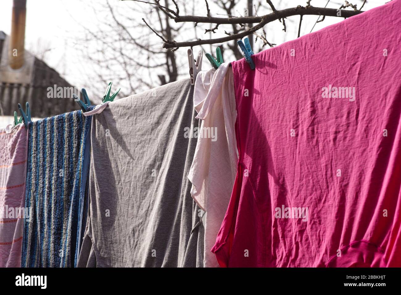 Washed laundry hanging outdoors. Close-up. Stock Photo