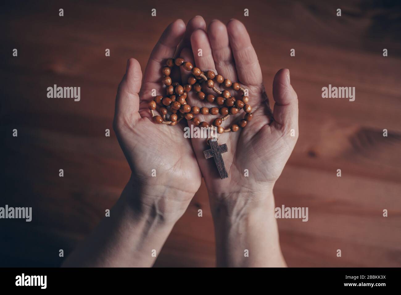 Woman hands praying rosary beads hi-res stock photography and images ...