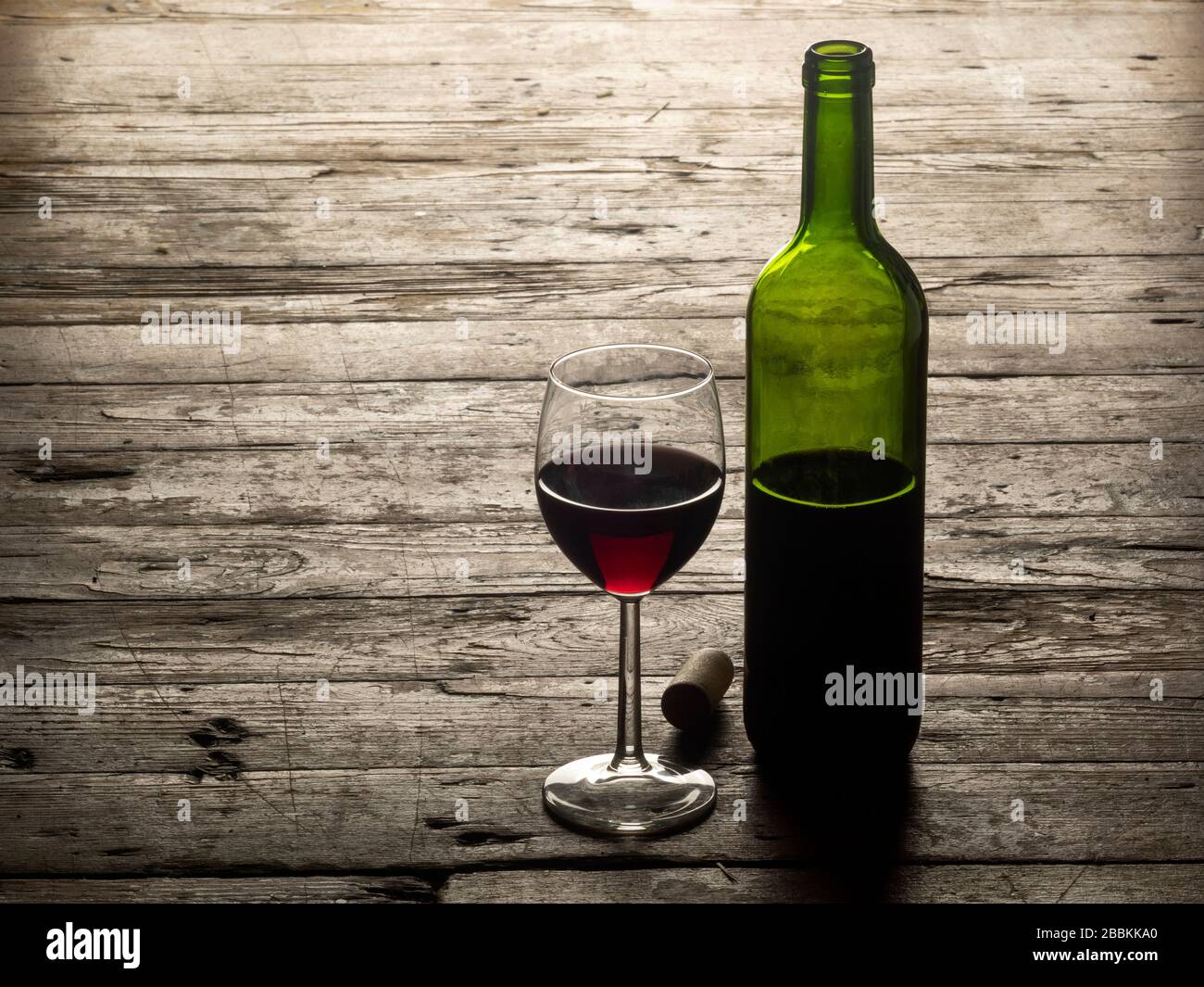 red wine bottle and glass closeup horizontal background Stock Photo