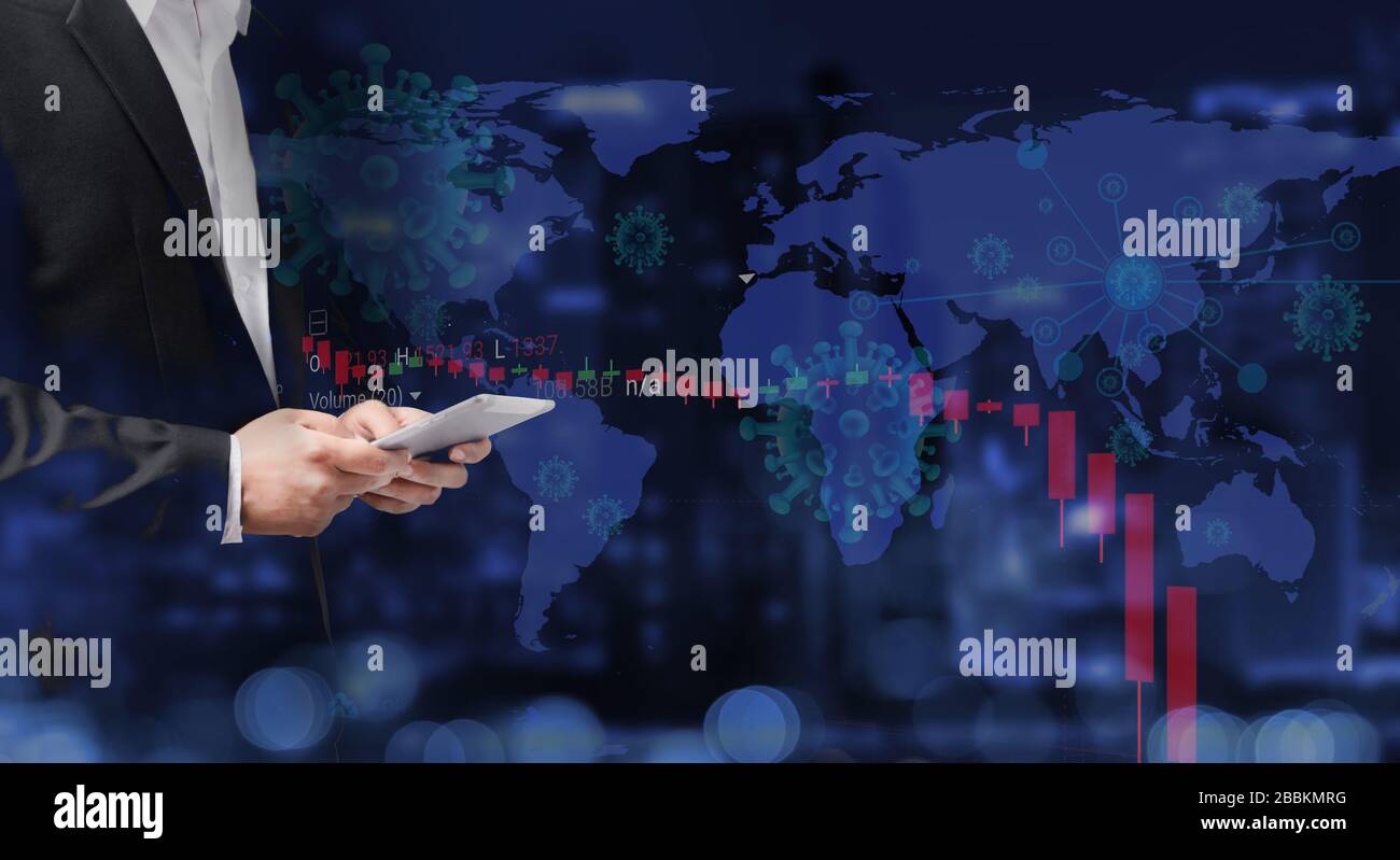 Businessman using tablet analyzing data. World stock graph has down from virus corona outbreak. COVID-19 shutdown world business economy concept. Stock Photo