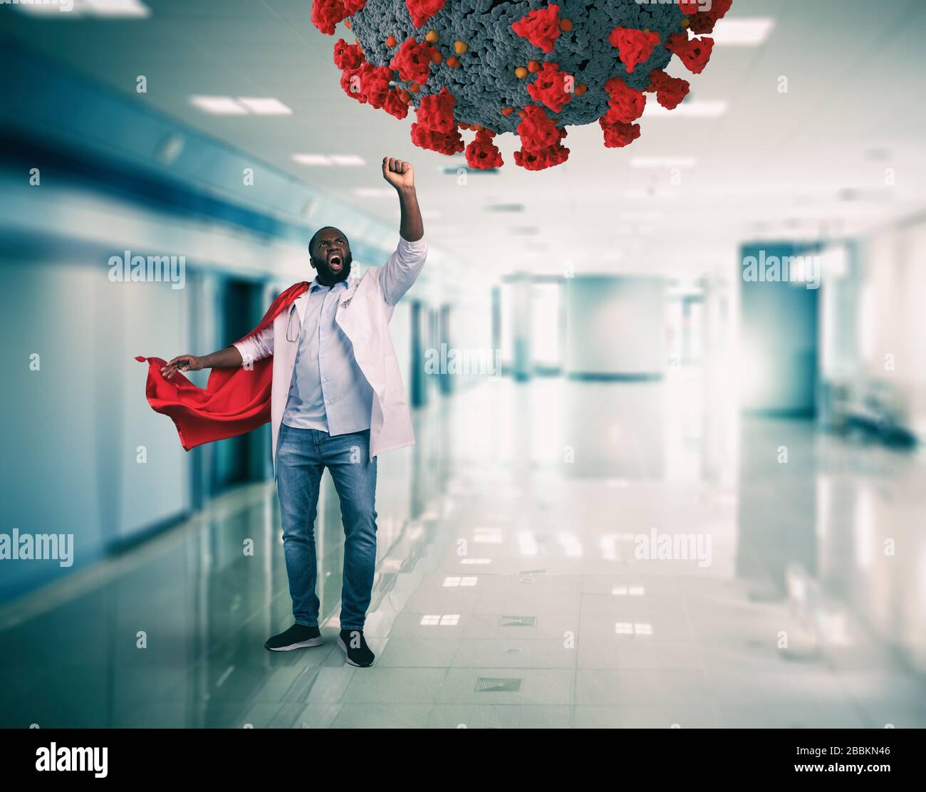 Super hero doctor with red cloak fights against a big virus Stock Photo