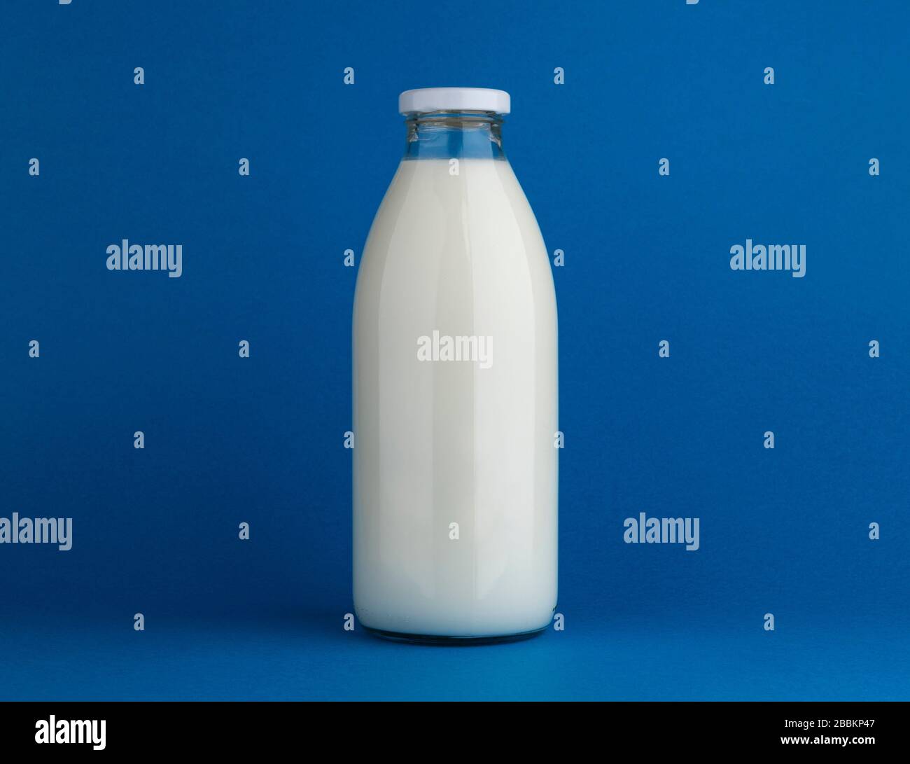 Download Glass Milk Bottle Mock Up On Blue Background Stock Photo Alamy