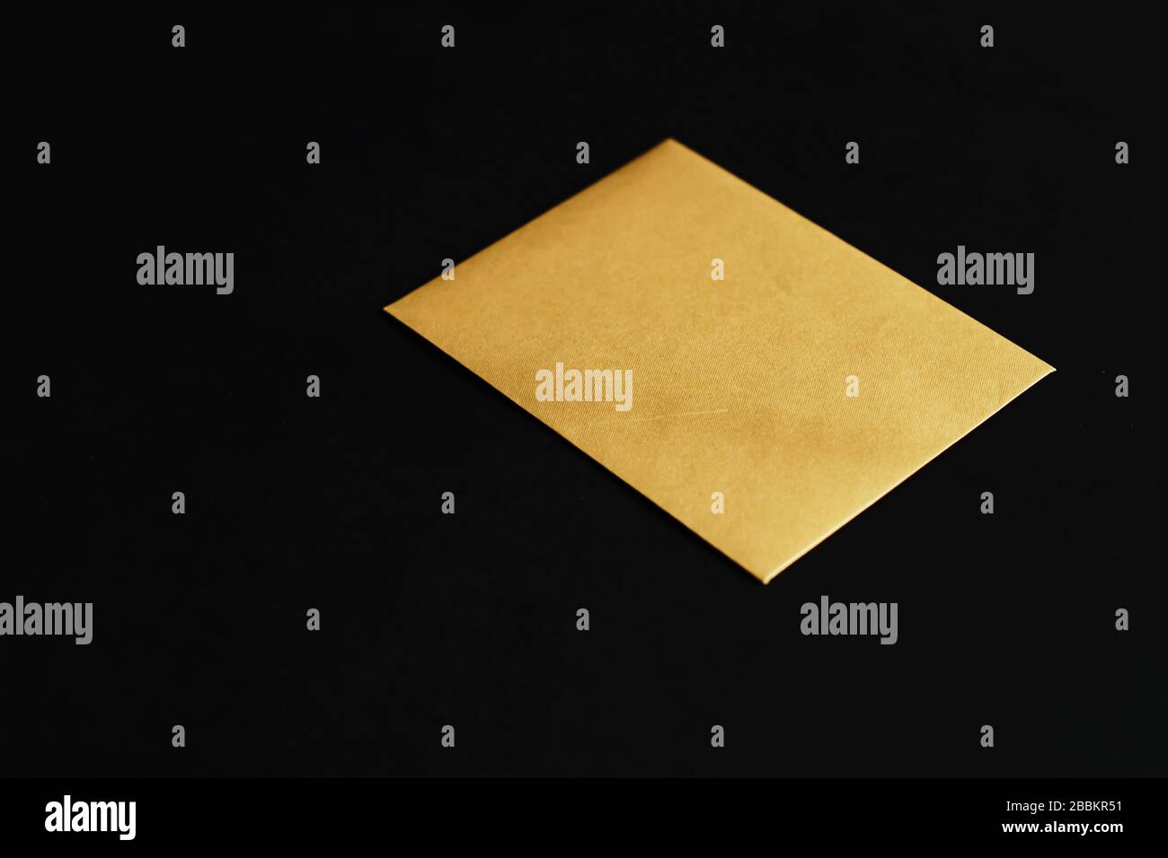Blank golden paper card on black background, premium business and ...