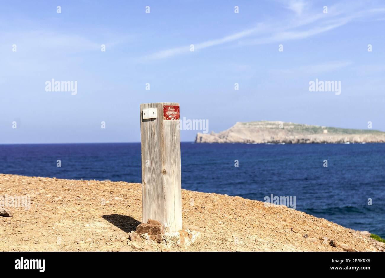 A wooden sign on the Cami de Cavalls (horses walk) coastal walk in Menorca island,2018. Stock Photo