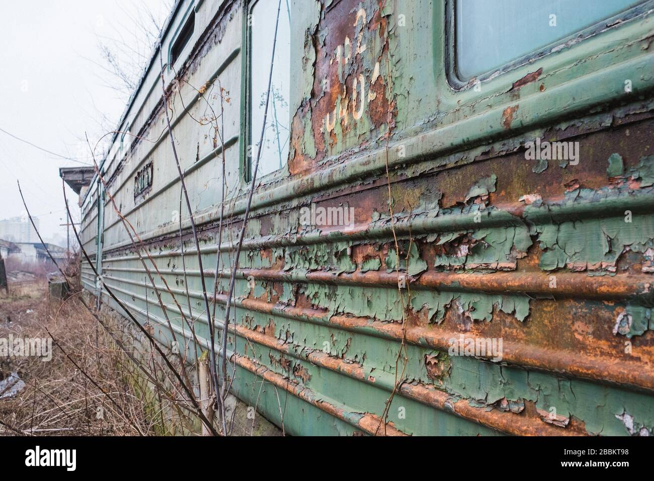 old rusty weathered peeled paint of an old wagon. Blue abandoned