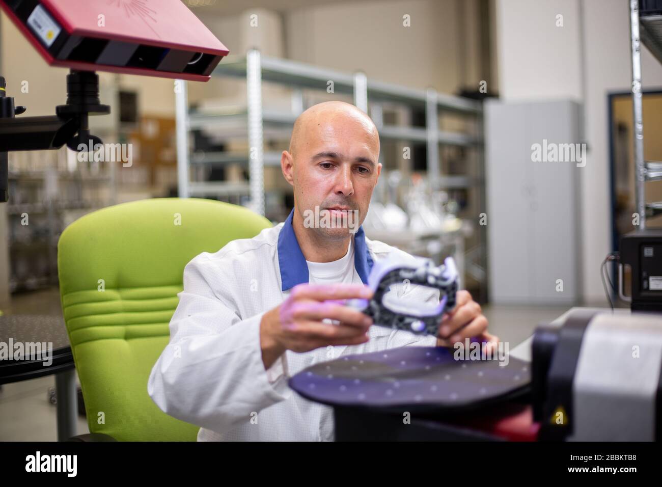 Quality engineer scanning some moldings component by professional