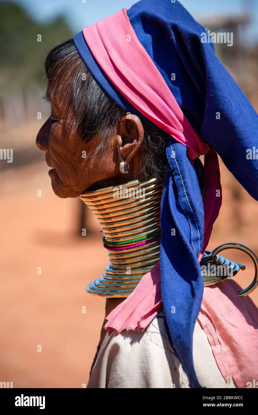 Pan Pet, Kayah State, Myanmar - February 2020: Portrait of an elderly Kayan longneck woman or Paduang wearing traditional brass neck rings. Stock Photo