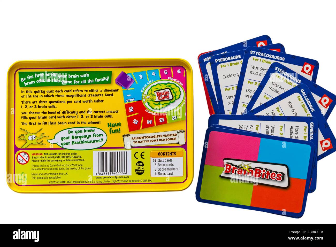 Brainbites Dinosaurs gain brain cells in this quirky quiz by the Green Board Game Co set on white background - bottom of tin and cards Stock Photo