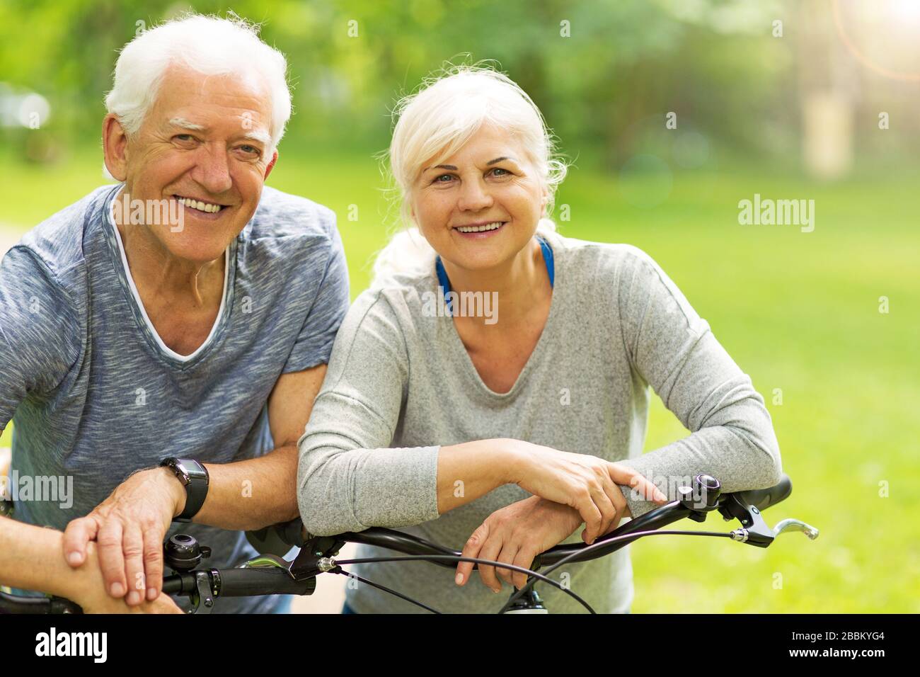Senior couple on bicycles Stock Photo