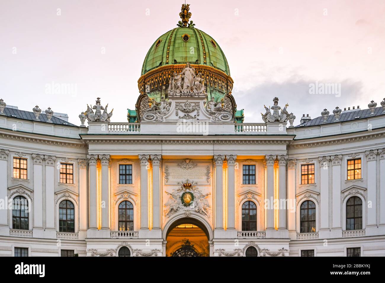 VIENNA, AUSTRIA - NOVEMBER 2019: The exterior of the Hofburg Imperial Palace in Vienna, floodlit at dusk. Stock Photo