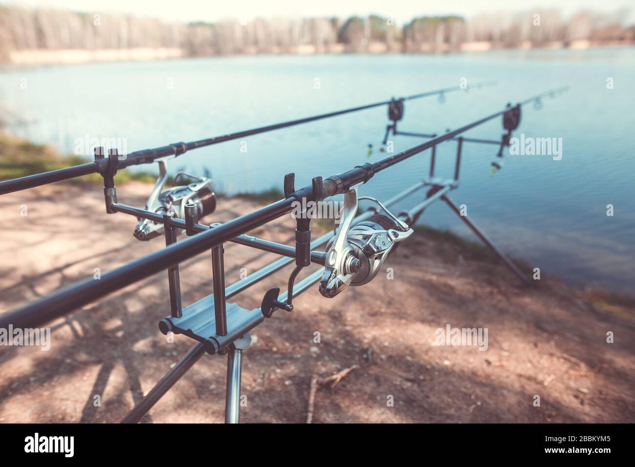 Fishermen with their fishing rods ready to fish on a sunset at the seashore  Stock Photo - Alamy