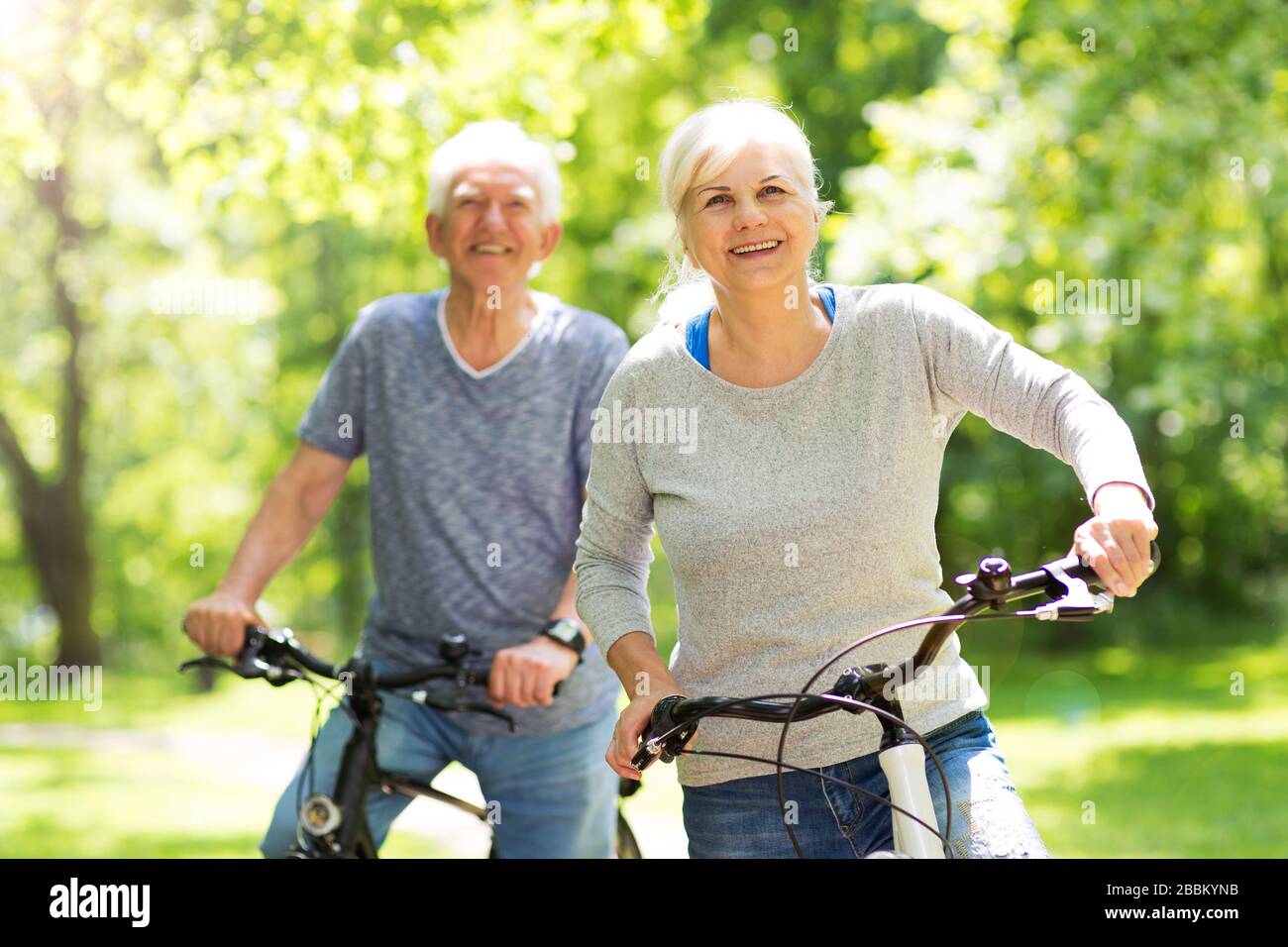 Senior couple on bicycles Stock Photo