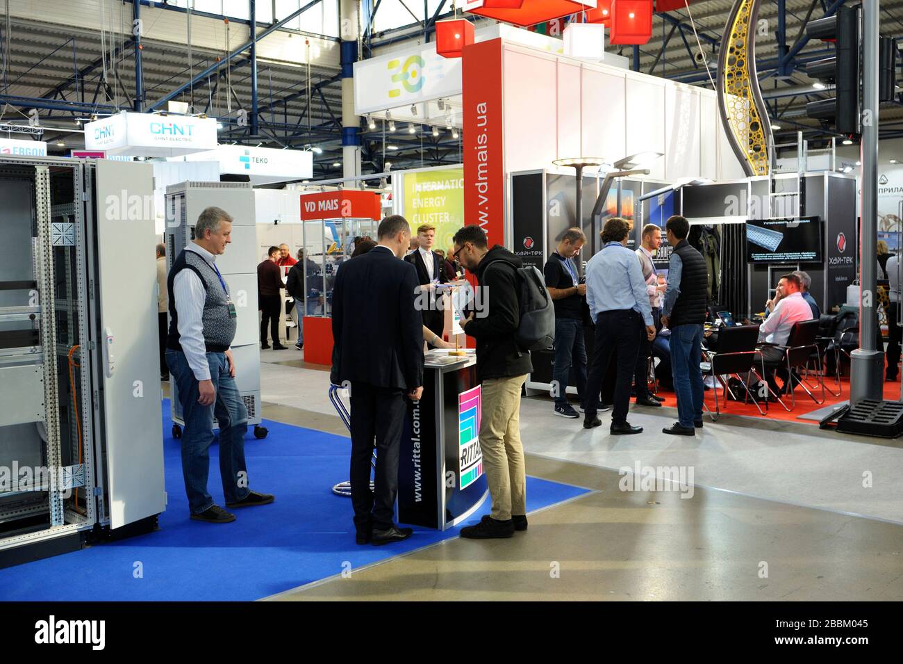 People visitors walking around stands, equipment and machines. Exhibition Industrial Ukraine-2019. November 6, 2019.Kiev, Ukraine Stock Photo