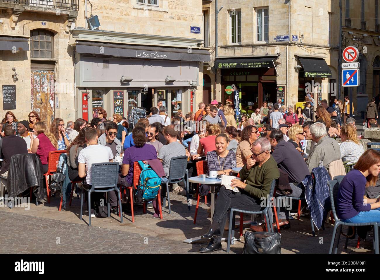 Crowded pavement café outside Le Saint George' café at Place Camille Jullian in Bordeaux Stock Photo