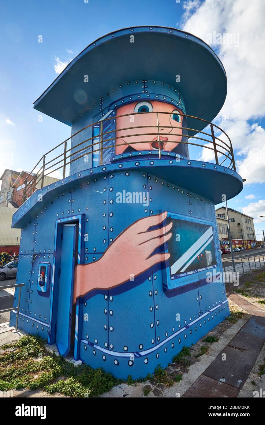 Street art depicting a face and hand painted on a former lock keeper's building at the Quai de Sénégal in Bacalan-Bassins à Flot, Bordeaux Stock Photo