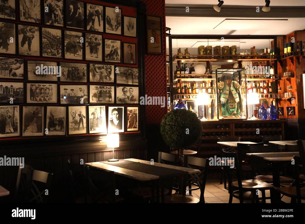 Spanish bar- Atmospheric, traditional restaurant /pub.Spanish culture. Bull fighter suit of lights.Seville. Andalusia.Feel good Full frame. No people. Stock Photo