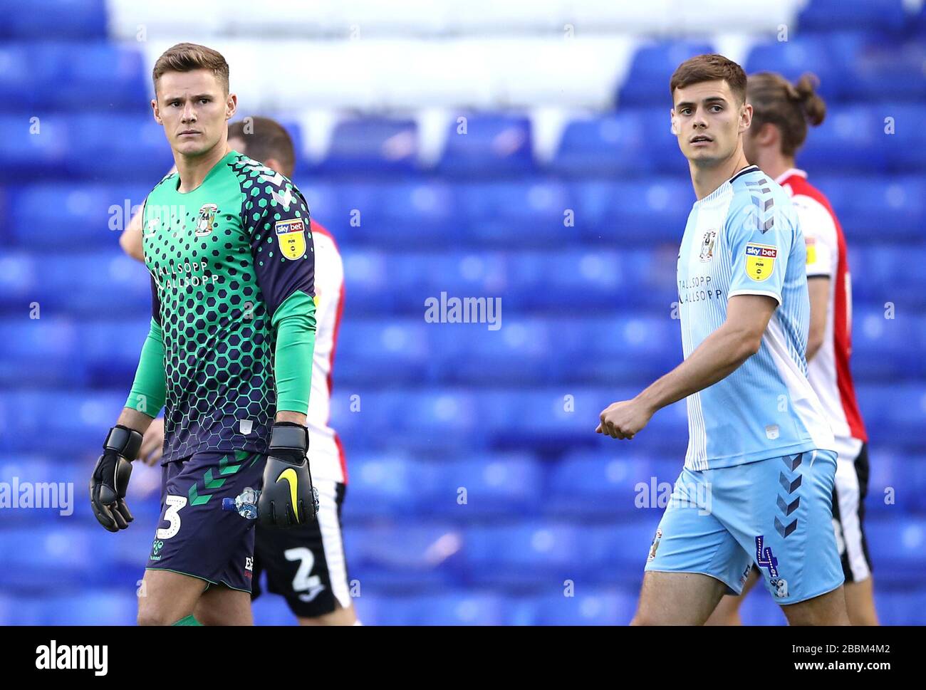 Coventry City goalkeeper Ben Wilson (left) and Michael Rose walk onto the pitch prior to kick-off Stock Photo