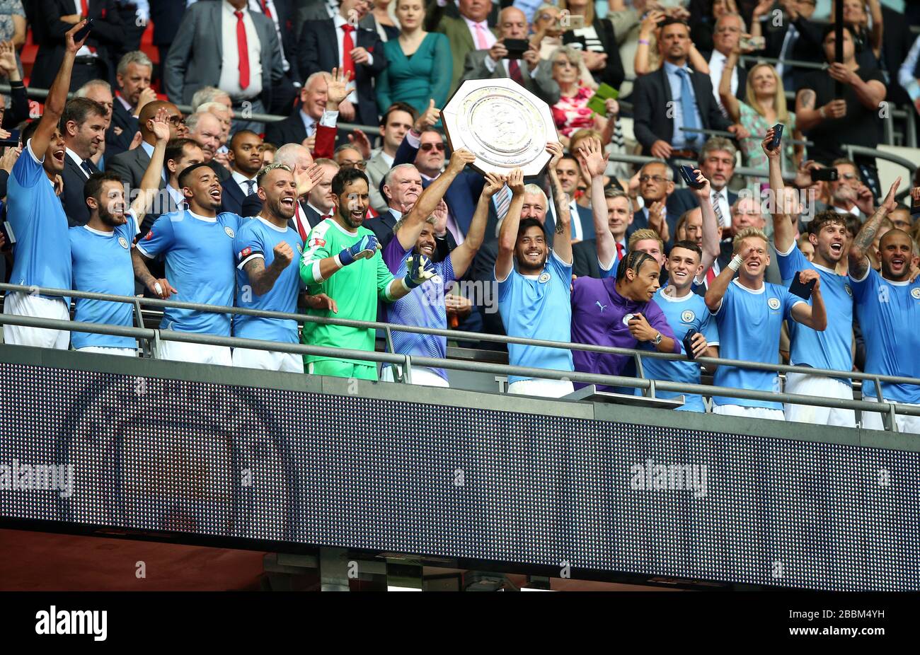 Manchester City's Sergio Aguero and David Silva lift the Community Shield trophy Stock Photo